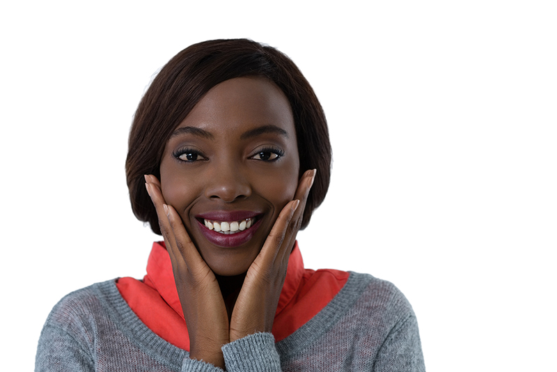 smiling woman touching her cheecks