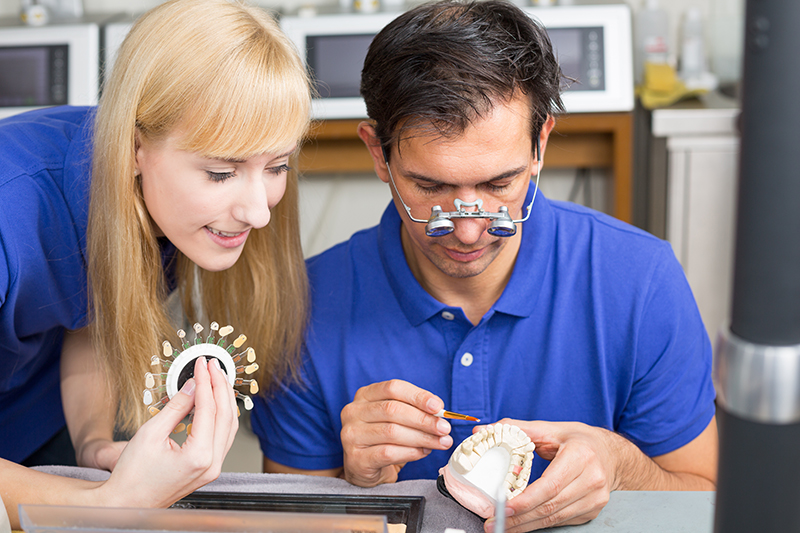 dental technician creating dental caps or crowns