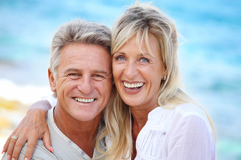 smiling couple near the beach