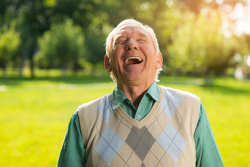man having a laugh in a park
