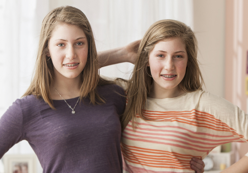 two teenage girls with braces
